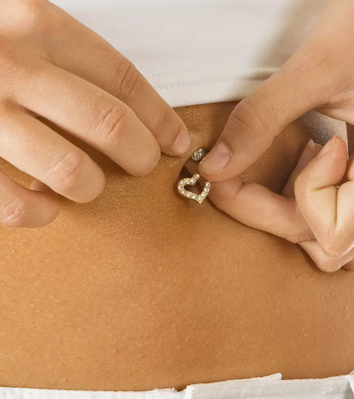 A-woman-changing-her-belly-piercing.jpg