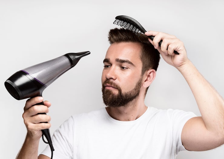 man-drying-his-hair-brushing-it 23-2148696637