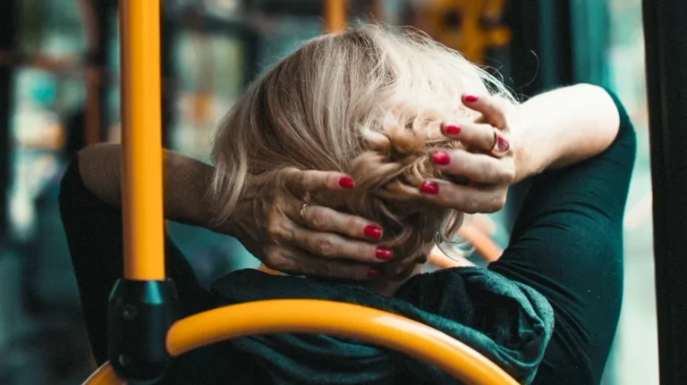 Woman-Adjusting-Hair-While-Traveling-In-Bus-1296x728-header