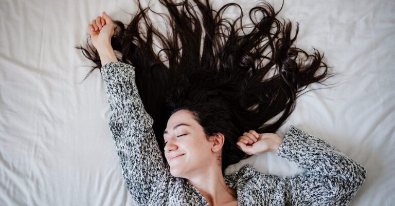 woman-with-long-hair-lying-on-bed-1200x628-facebook-1200x628